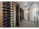 Modern wine room with floor-to-ceiling racks displaying an extensive wine collection at 4702 Amazing View St, Las Vegas, NV 89129