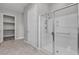 Modern bathroom showcasing glass-enclosed shower, tile flooring, and walk-in closet at 4829 E Beacon Ridge Dr, Pahrump, NV 89061