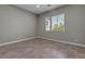 Sunlit bedroom with ceramic tile flooring and double-hung windows at 4829 E Beacon Ridge Dr, Pahrump, NV 89061