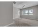 An empty bedroom with large windows, neutral walls, plush carpet, and plenty of natural light at 4829 E Beacon Ridge Dr, Pahrump, NV 89061