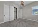 Bedroom with a closet featuring sliding doors and plush carpeting at 4829 E Beacon Ridge Dr, Pahrump, NV 89061