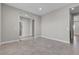 Open-concept living area with ceramic tile flooring and neutral paint at 4829 E Beacon Ridge Dr, Pahrump, NV 89061