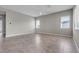 A spacious living area with tile flooring, offering plenty of natural light through large windows at 4829 E Beacon Ridge Dr, Pahrump, NV 89061