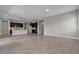 Open-concept living room and kitchen with tile floors, neutral colors and ample light at 4829 E Beacon Ridge Dr, Pahrump, NV 89061