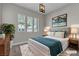Staged main bedroom featuring a comfortable bed and stylish decor at 4829 E Beacon Ridge Dr, Pahrump, NV 89061