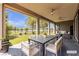 Covered patio featuring outdoor dining area with ceiling fans at 4829 E Beacon Ridge Dr, Pahrump, NV 89061
