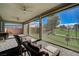 Covered outdoor living space boasts ceiling fans, comfortable seating, and beautiful backyard views at 4829 E Beacon Ridge Dr, Pahrump, NV 89061