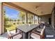 Inviting covered patio with outdoor dining and lounge area, overlooking a well-manicured lawn at 4829 E Beacon Ridge Dr, Pahrump, NV 89061