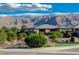 Beautiful home featuring well-maintained landscaping with mountain views in the background at 4829 E Beacon Ridge Dr, Pahrump, NV 89061