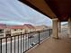 Home balcony with extended coverage overlooking quiet residential street at 5699 Woodchester Ave, Las Vegas, NV 89139