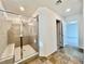 Modern shower with a bench, glass enclosure, and an ensuite bathroom at 5699 Woodchester Ave, Las Vegas, NV 89139