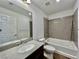 Bathroom featuring a bathtub, shower, toilet, and granite countertop vanity at 5699 Woodchester Ave, Las Vegas, NV 89139