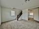 Bonus room with stairway, bright natural light, and neutral wall paint at 5699 Woodchester Ave, Las Vegas, NV 89139