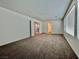 Spacious bonus room with natural lighting, neutral wall paint, and entry door at 5699 Woodchester Ave, Las Vegas, NV 89139