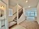 Open entryway with tiled floors, carpeted stairs, and access to the living area at 5699 Woodchester Ave, Las Vegas, NV 89139