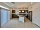 Modern kitchen featuring stainless steel appliances, an island, and granite countertops at 5699 Woodchester Ave, Las Vegas, NV 89139