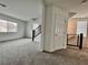 A naturally lit loft space with stairway access and modern railing at 5699 Woodchester Ave, Las Vegas, NV 89139