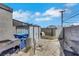 Backyard featuring cement, block wall, small metal storage shed, secured dog run, and dog house at 6008 Pebble Beach Blvd, Las Vegas, NV 89108