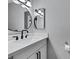 Bathroom featuring a modern vanity with a stylish mirror and lighting at 6008 Pebble Beach Blvd, Las Vegas, NV 89108