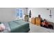 Bright bedroom featuring a window, carpeted floor, and simple decor at 6008 Pebble Beach Blvd, Las Vegas, NV 89108
