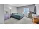 Neutral bedroom showing a carpeted floor, window with blinds, and simple decor at 6008 Pebble Beach Blvd, Las Vegas, NV 89108