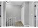 Hallway with stairwell featuring neutral walls, white trim, and carpeted floors at 6008 Pebble Beach Blvd, Las Vegas, NV 89108