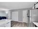 Open-concept kitchen featuring stainless steel appliances and a door that leads to another living area at 6008 Pebble Beach Blvd, Las Vegas, NV 89108