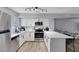Bright kitchen with stainless steel appliances, white subway tile backsplash, and breakfast bar at 6008 Pebble Beach Blvd, Las Vegas, NV 89108