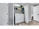 Functional laundry closet featuring a white washer and dryer at 6008 Pebble Beach Blvd, Las Vegas, NV 89108