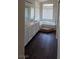 Bright bathroom with a double sink vanity, large soaking tub with step, and a picture window at 6113 Desert Haven Rd, Las Vegas, NV 89130