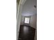 Cozy bedroom with wood laminate flooring and natural light from a window at 6113 Desert Haven Rd, Las Vegas, NV 89130