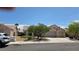 Charming single-story home featuring a two-car garage and desert landscaping in front at 6113 Desert Haven Rd, Las Vegas, NV 89130