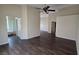 Spacious living room with modern floors, a peek into the bathroom and hallway entrance at 6113 Desert Haven Rd, Las Vegas, NV 89130