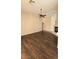 Spacious living room featuring modern dark wood flooring and a ceiling fan at 6113 Desert Haven Rd, Las Vegas, NV 89130