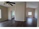 Bright living room with dark wood floors and lots of natural light at 6113 Desert Haven Rd, Las Vegas, NV 89130