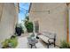 Charming backyard offers a patio with seating, barbecue, and string lights, creating an intimate outdoor retreat at 622 Quaint Acres Ave, Las Vegas, NV 89183