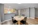 Dining area with updated colors and wood-look floors open to the kitchen area at 622 Quaint Acres Ave, Las Vegas, NV 89183