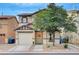 Charming two-story home features a one car garage and a welcoming front entrance at 622 Quaint Acres Ave, Las Vegas, NV 89183