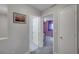 The hallway offers easy access to rooms with neutral wall colors and natural lighting at 622 Quaint Acres Ave, Las Vegas, NV 89183