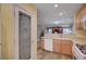 Kitchen featuring a pantry, white appliances, and seamless open living at 622 Quaint Acres Ave, Las Vegas, NV 89183