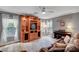 Cozy living area featuring a large entertainment center, area rug, and bright windows at 622 Quaint Acres Ave, Las Vegas, NV 89183