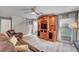 Comfortable living area with a ceiling fan, wood-look floors, and a staircase at 622 Quaint Acres Ave, Las Vegas, NV 89183