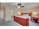 Comfortable main bedroom featuring a ceiling fan, bedside tables, and ensuite bathroom at 622 Quaint Acres Ave, Las Vegas, NV 89183