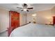 Bright main bedroom boasting carpet flooring, a ceiling fan, and wardrobe at 622 Quaint Acres Ave, Las Vegas, NV 89183