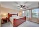 Spacious main bedroom featuring a ceiling fan, carpet flooring, and lots of natural light at 622 Quaint Acres Ave, Las Vegas, NV 89183