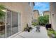 Relaxing backyard patio with comfortable seating, string lights, and sliding glass door access to the home at 622 Quaint Acres Ave, Las Vegas, NV 89183