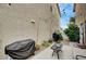 Outdoor patio features string lights, a grill, and outdoor furniture for entertainment at 622 Quaint Acres Ave, Las Vegas, NV 89183