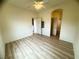 Bright bedroom with a ceiling fan, neutral walls, and hardwood floors create a serene and inviting space at 6313 Snap Ridge St # 201, North Las Vegas, NV 89081