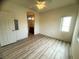 Bright bedroom with a ceiling fan, neutral walls, and hardwood floors create a serene and inviting space at 6313 Snap Ridge St # 201, North Las Vegas, NV 89081