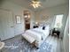 Cozy bedroom features a comfortable bed with stylish linens and natural lighting from the window at 6313 Snap Ridge St # 201, North Las Vegas, NV 89081